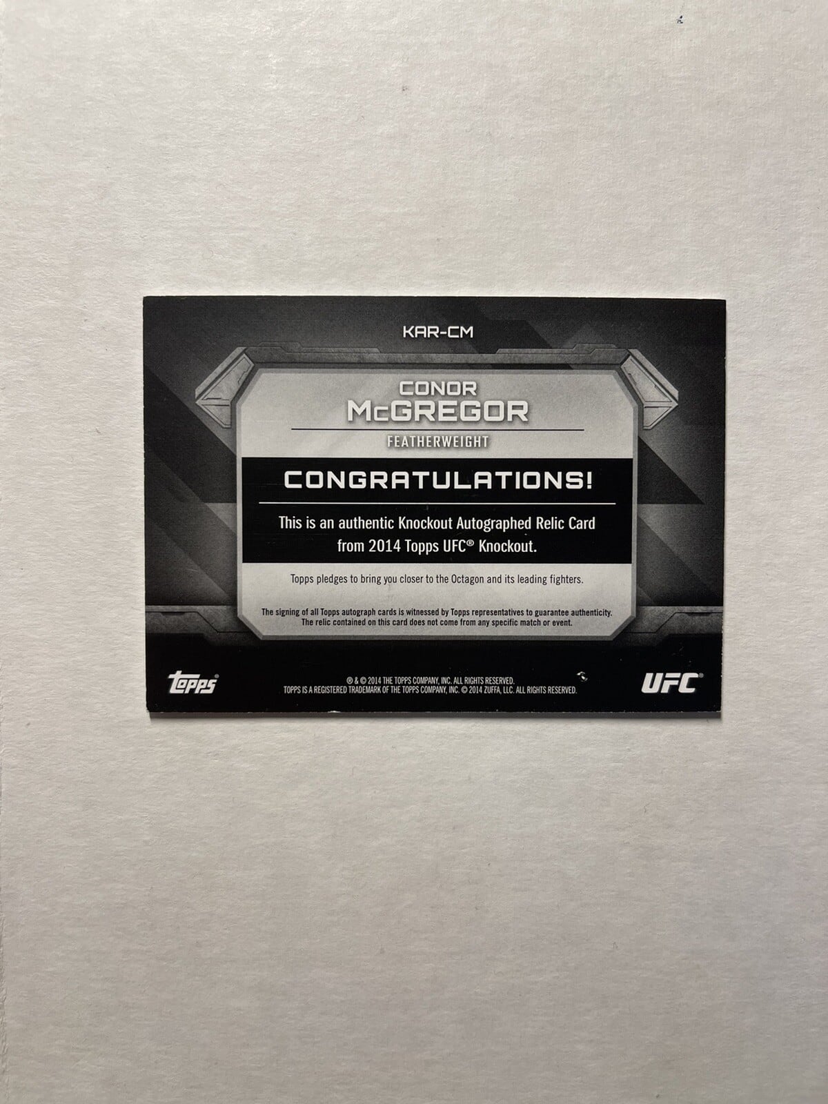 2014 Topps UFC Knockout #KAR-CM — Conor McGregor — Ruby parallel, back
